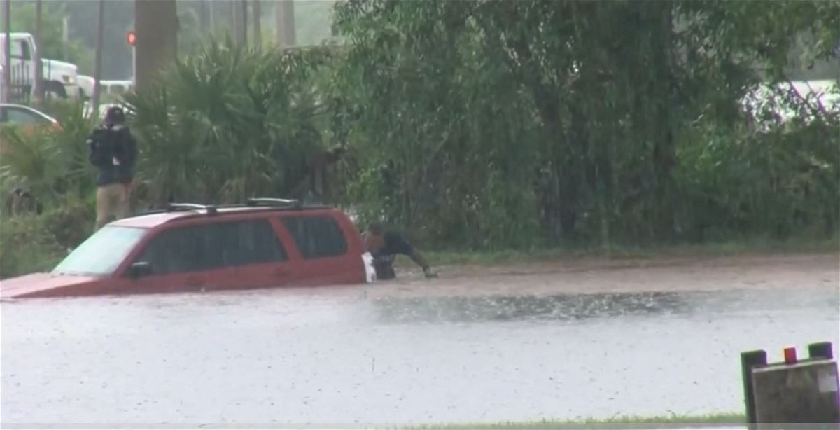 <i>WBBH via CNN Newsource</i><br/>A man was saved after his SUV plunged into a ditch during a storm in south Fort Myers