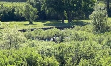 Two people aboard a small plane were injured Sunday morning when their aircraft made an emergency landing near Interstate 25.