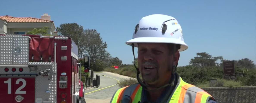 <i>KGTV via CNN Newsource</i><br/>Balfour Beatty construction workers working on an almost finished project at Del Mar Heights stopped what they were doing and started getting water to the flames.
