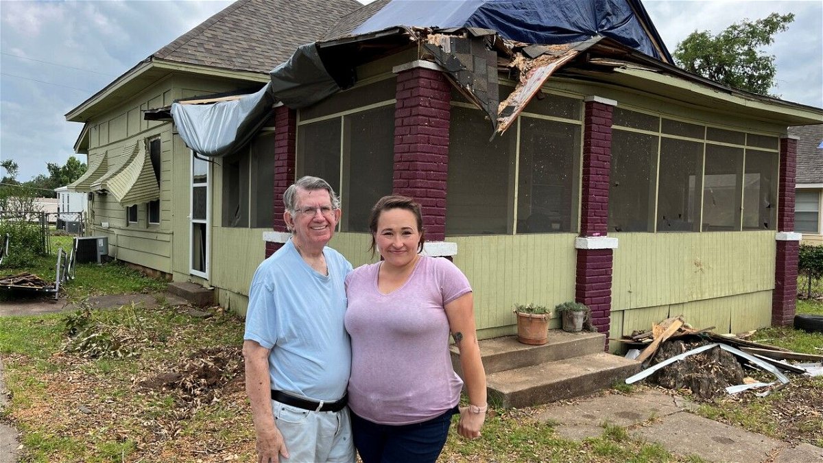<i>KJRH via CNN Newsource</i><br/>Larry Hayes (left) was approached by two men shortly after the May 25 tornado damaged its roof and electrical system.
