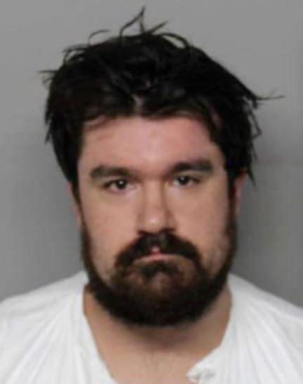 <i>ROYAL OAK POLICE/WWJ via CNN Newsource</i><br/>Levi Trahern Smith was arrested after police found him outside his former coworker's home in Royal Oak over the weekend with a gun