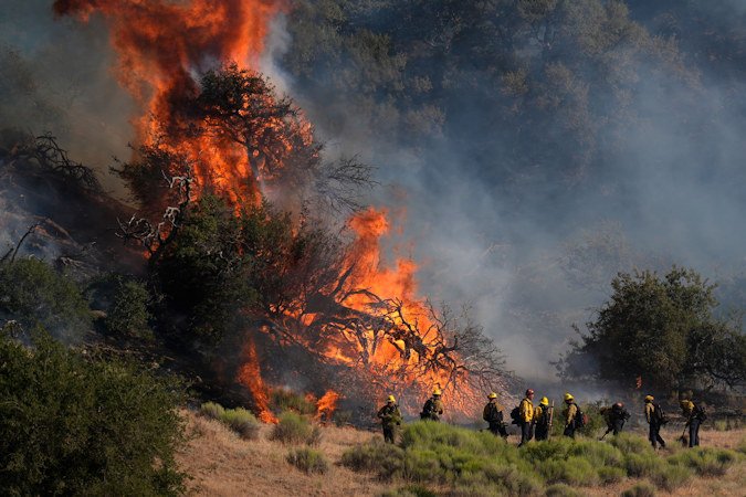 Firefighters work against the advancing Post Fire on Saturday, June 15 in Gorman, California.