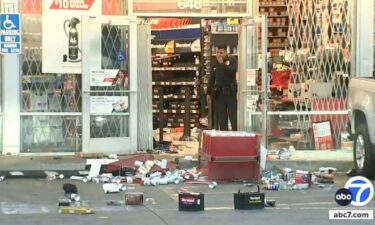 Police say an AutoZone in South Los Angeles was looted by a large crowd after a street takeover at Century Boulevard and Hoover Street.