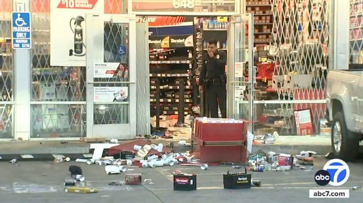 <i>KABC via CNN Newsource</i><br/>Police say an AutoZone in South Los Angeles was looted by a large crowd after a street takeover at Century Boulevard and Hoover Street.