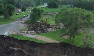 Blue Earth County officials on Friday bought and demolished the iconic Rapidan Dam Store to prevent it from falling into the Blue Earth River.