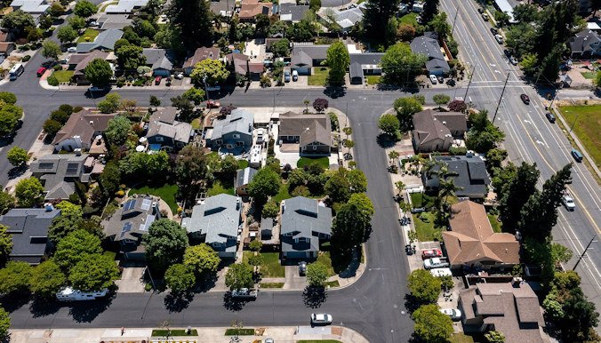 Homes in Napa, California, are seen here on May 6. US homeowners are now paying an average of $18,118 a year on property taxes, homeowners’ insurance, maintenance, energy, and various other expenses linked to owning a home.