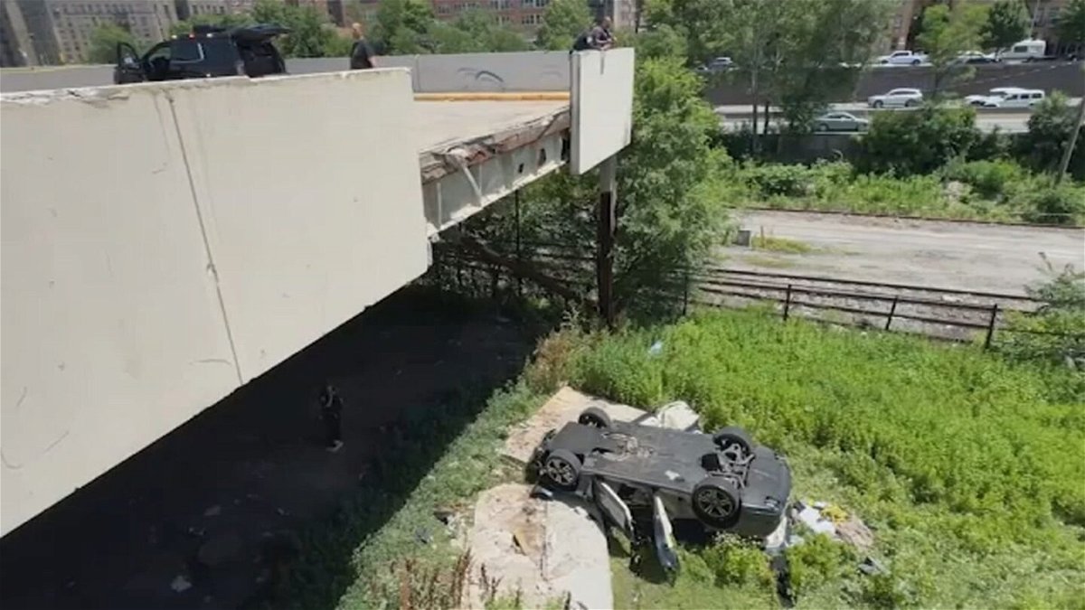 <i>WABC via CNN Newsource</i><br/>An overturned car sat below the parking deck it plummeted from in the Bronx.