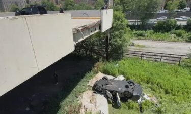 An overturned car sat below the parking deck it plummeted from in the Bronx.