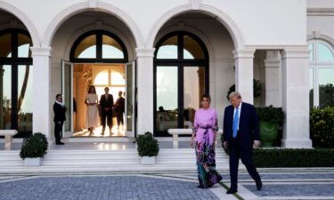 Former President Donald Trump arrives at the home of billionaire investor John Paulson for a fundraising dinner.