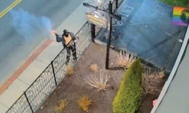 Surveillance footage shows a person tossing an explosive at The Satanic Temple in Salem