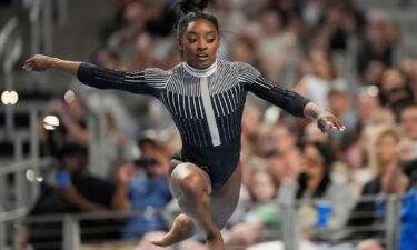 Simone Biles competes on the beam Friday in Fort Worth