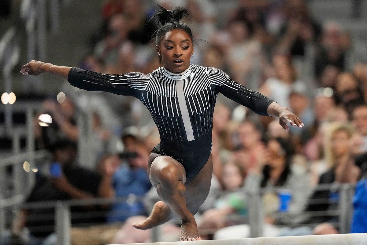 <i>Jim Cowsert/AP via CNN Newsource</i><br/>Simone Biles competes on the beam Friday in Fort Worth