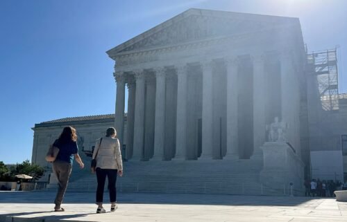 Visitors walk across the west plaza of the US Supreme Court on June 7
