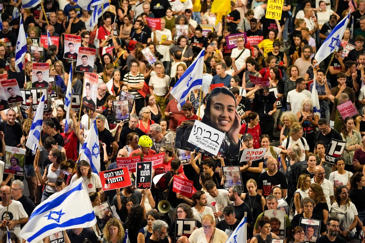 <i>Ohad Zwigenberg/AP via CNN Newsource</i><br/>People protest for the release of hostages in Tel Aviv on Jun 8.