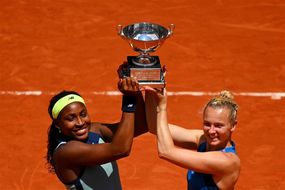 <i>Tim Goode/Getty Images via CNN Newsource</i><br/>Coco Gauff and Katerina Siniakova celebrate with the trophy after victory.