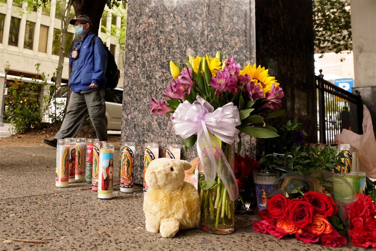 <i>Rich Pedroncelli/AP via CNN Newsource</i><br/>A memorial grew near the site of the late-night shooting in April 2022.