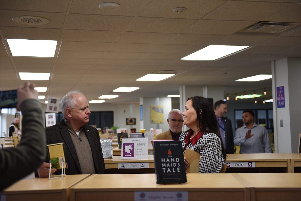 <i>Sam Woodward/USA Today Network via CNN Newsource</i><br/>Minnesota Gov. Tim Walz speaks to a library specialist in March 2024 at Como Senior High School in St. Paul