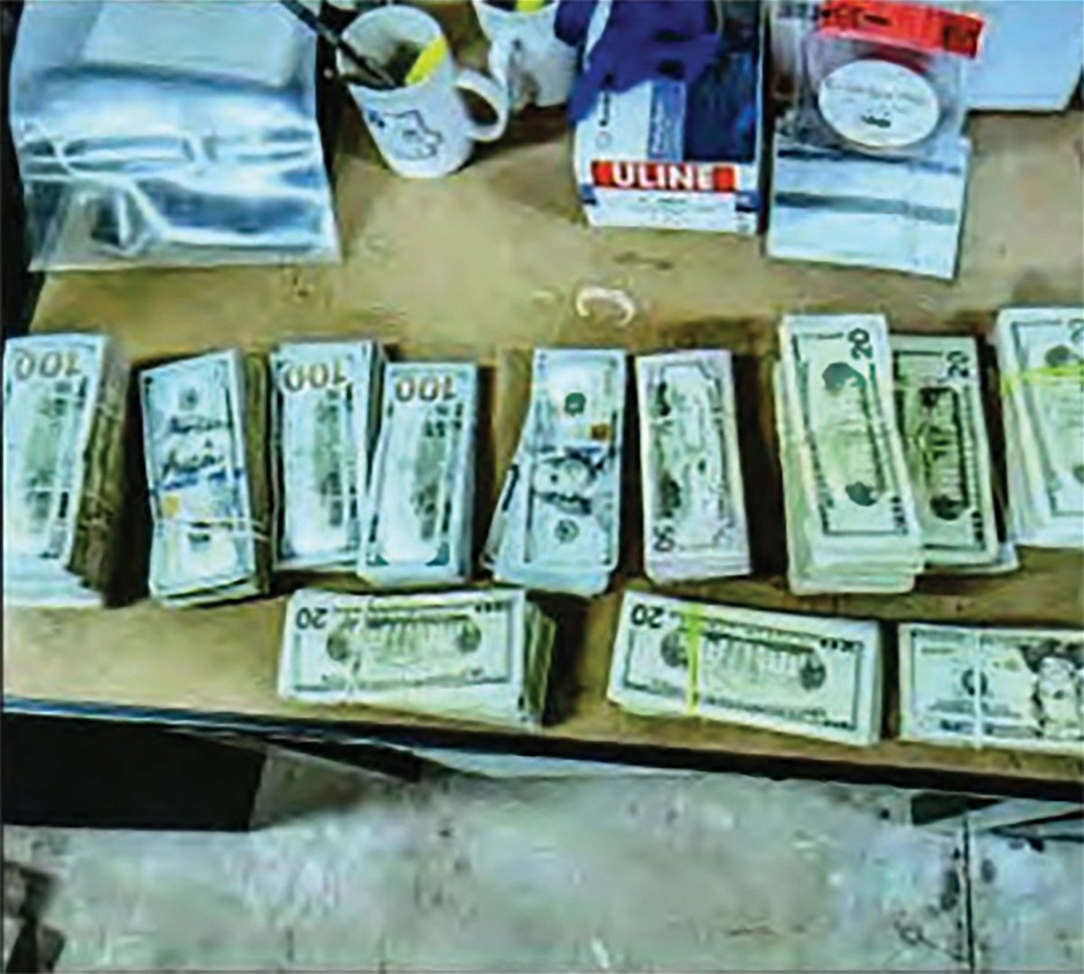 <i>United States District Court via CNN Newsource</i><br/>Photos of the stacks of cash delivered by an unidentified woman to the home of a person identified as Juror #52 were included in an FBI affidavit over the federal case targeting the defrauding of federal child nutrition programs.