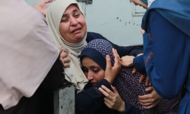 Palestinians mourn relatives killed in an Israeli bombardment in the Bureij area of central Gaza on June 4.
