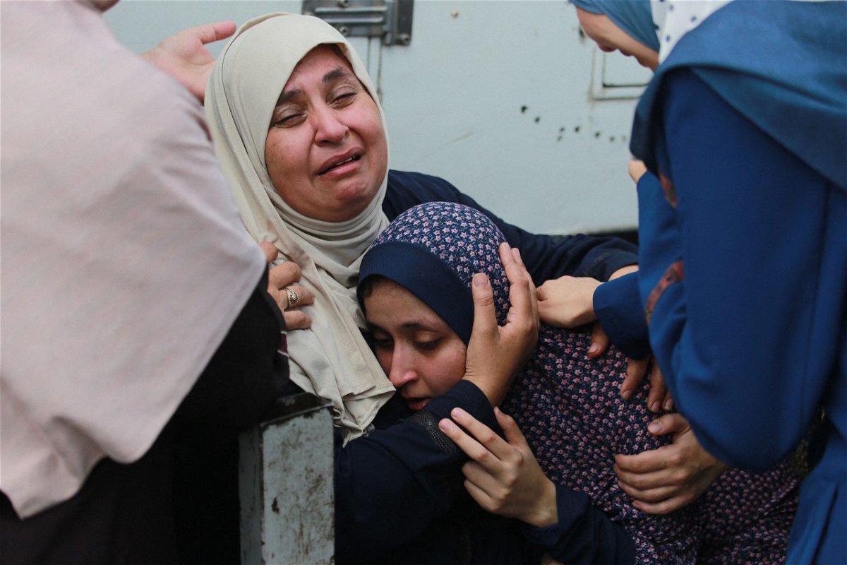 <i>Bashar Taleb/AFP via Getty Images via CNN Newsource</i><br/>Palestinians mourn relatives killed in an Israeli bombardment in the Bureij area of central Gaza on June 4.