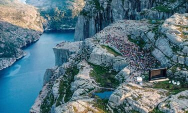 People gather in the mountains near Preikestolen to see the movie "Mission: Impossible Fallout."