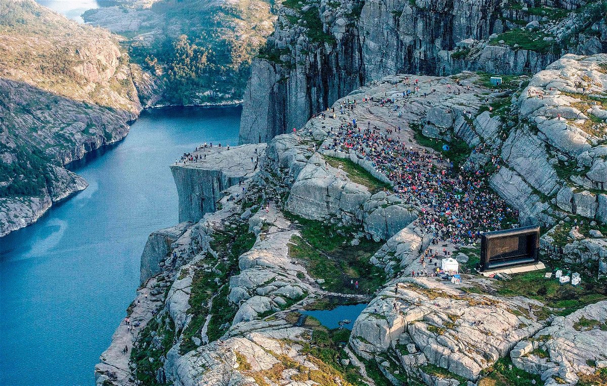 <i>Carina Johansen/NTB Scanpix/AFP/Getty Images via CNN Newsource</i><br/>People gather in the mountains near Preikestolen to see the movie 