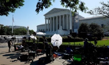 TV journalists work outside of the US Supreme Court Building on June 14 in Washington
