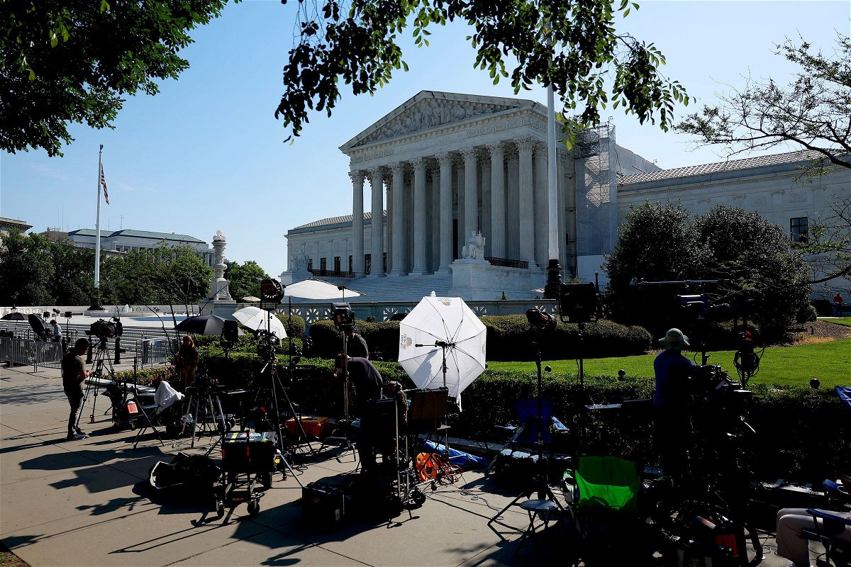 <i>Anna Moneymaker/Getty Images via CNN Newsource</i><br/>TV journalists work outside of the US Supreme Court Building on June 14 in Washington