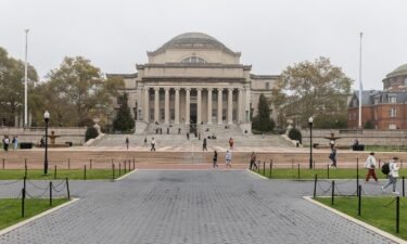 People walk past Columbia University in New York in October 2023. Columbia University says it’s placed three administrators on leave pending a university investigation.