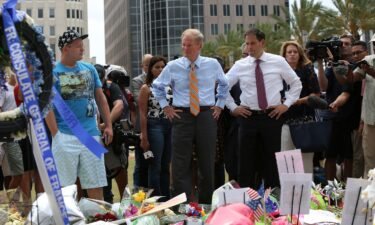 Then-Florida Sen. Bill Nelson and Sen. Marco Rubio visit the Pulse shooting victims memorial at Dr. Phillips Center for the Performing Arts in Orlando