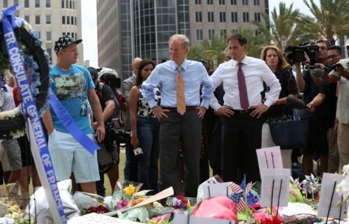 Then-Florida Sen. Bill Nelson and Sen. Marco Rubio visit the Pulse shooting victims memorial at Dr. Phillips Center for the Performing Arts in Orlando