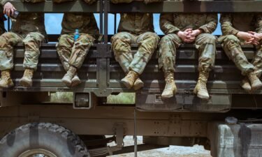 United States soldiers take a break as they prepare for a live fire drill to be presented to members of the media in April 2023 in San Antonio