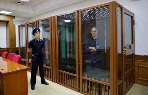 Gershkovich is seen inside an enclosure for defendants in Yekaterinburg