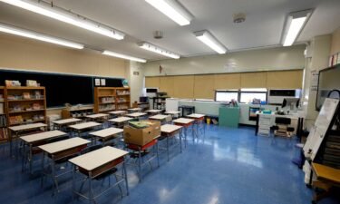 An empty classroom is pictured at Yung Wing School P.S. 124 New York City. Adding to a growing list of school districts banning cell phones