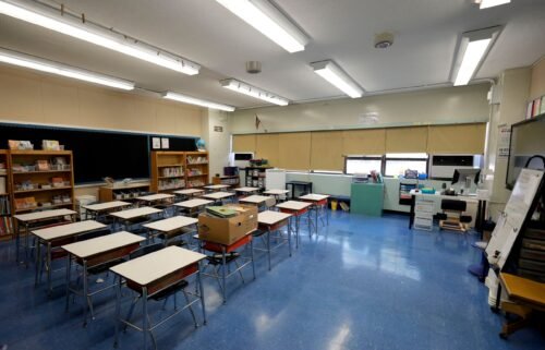 An empty classroom is pictured at Yung Wing School P.S. 124 New York City. Adding to a growing list of school districts banning cell phones