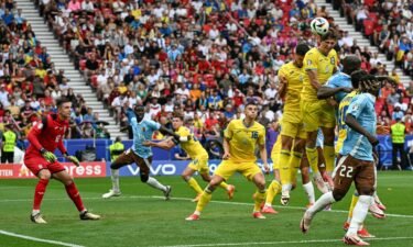 Illia Zabarnyi (No. 13) jumps to head the ball during the Euro 2024 Group E football match between Ukraine and Belgium at the Stuttgart Arena in Stuttgart on June 26.