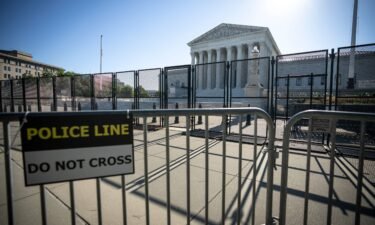 Security fencing surrounds the U.S. Supreme Court in June 2022 in Washington