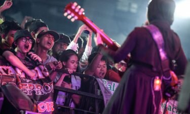 Fans go wild as VOB vocalist and guitarist Firda Kurnia performs on stage during a concert in Jakarta.