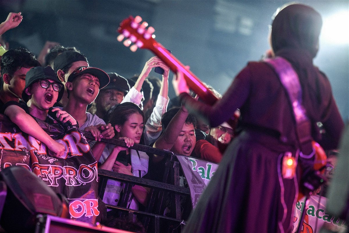 <i>Bay Ismoyo/AFP/Getty Images via CNN Newsource</i><br/>Fans go wild as VOB vocalist and guitarist Firda Kurnia performs on stage during a concert in Jakarta.