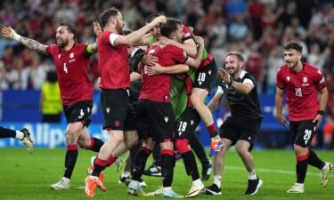 Georgia celebrates its victory after beating Portugal in its final Group F game.