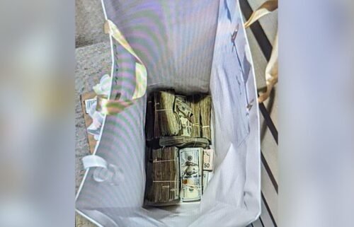 Prosecutors allege that a gift bag full of money was left at a juror's home.