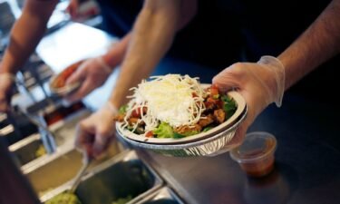 An employee prepares a burrito bowl at a Chipotle Mexican Grill Inc. restaurant in Louisville
