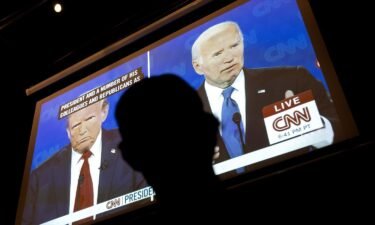 A man watches the CNN presidential debate during a watch party at Union Pub in Washington
