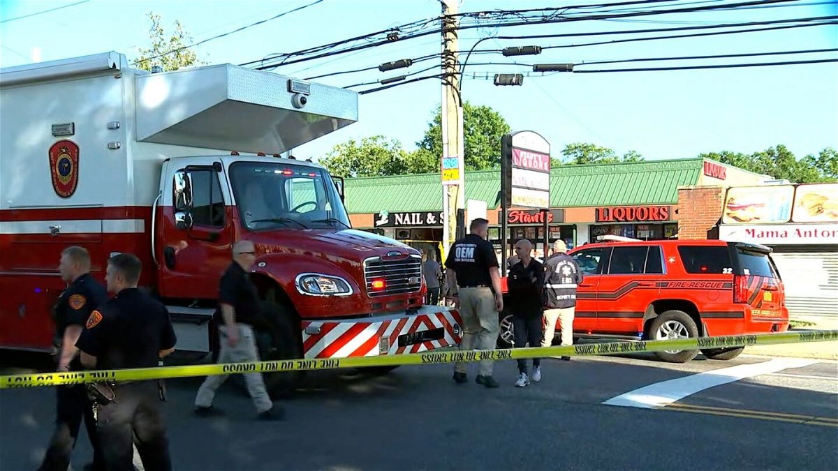 <i>WABC via CNN Newsource</i><br/>First responders on the scene after a minivan drove through a Long Island nail salon in Deer Park