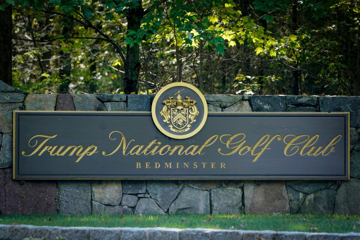 <i>Seth Wenig/AP via CNN Newsource</i><br/>A sign at the entrance to Trump National Golf Club in Bedminster