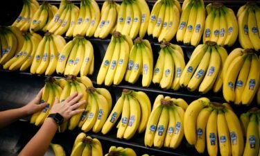 An employee arranges Chiquita Brands International Inc. bananas in the produce department inside a Kroger Co. grocery store in Louisville