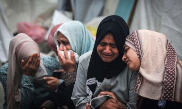 Palestinians mourn their relatives