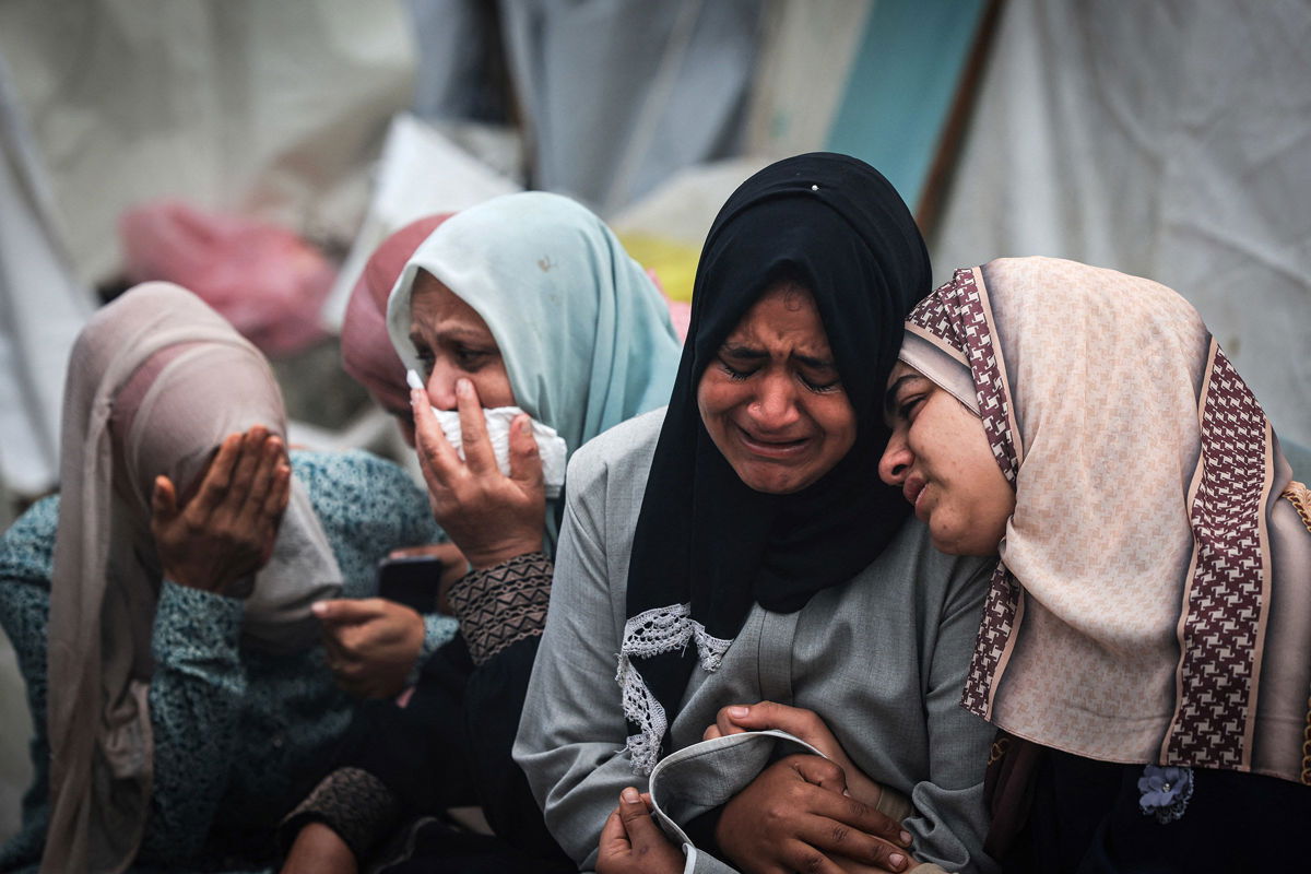 <i>Mahmud Hams/AFP/Getty Images via CNN Newsource</i><br/>Palestinians mourn their relatives