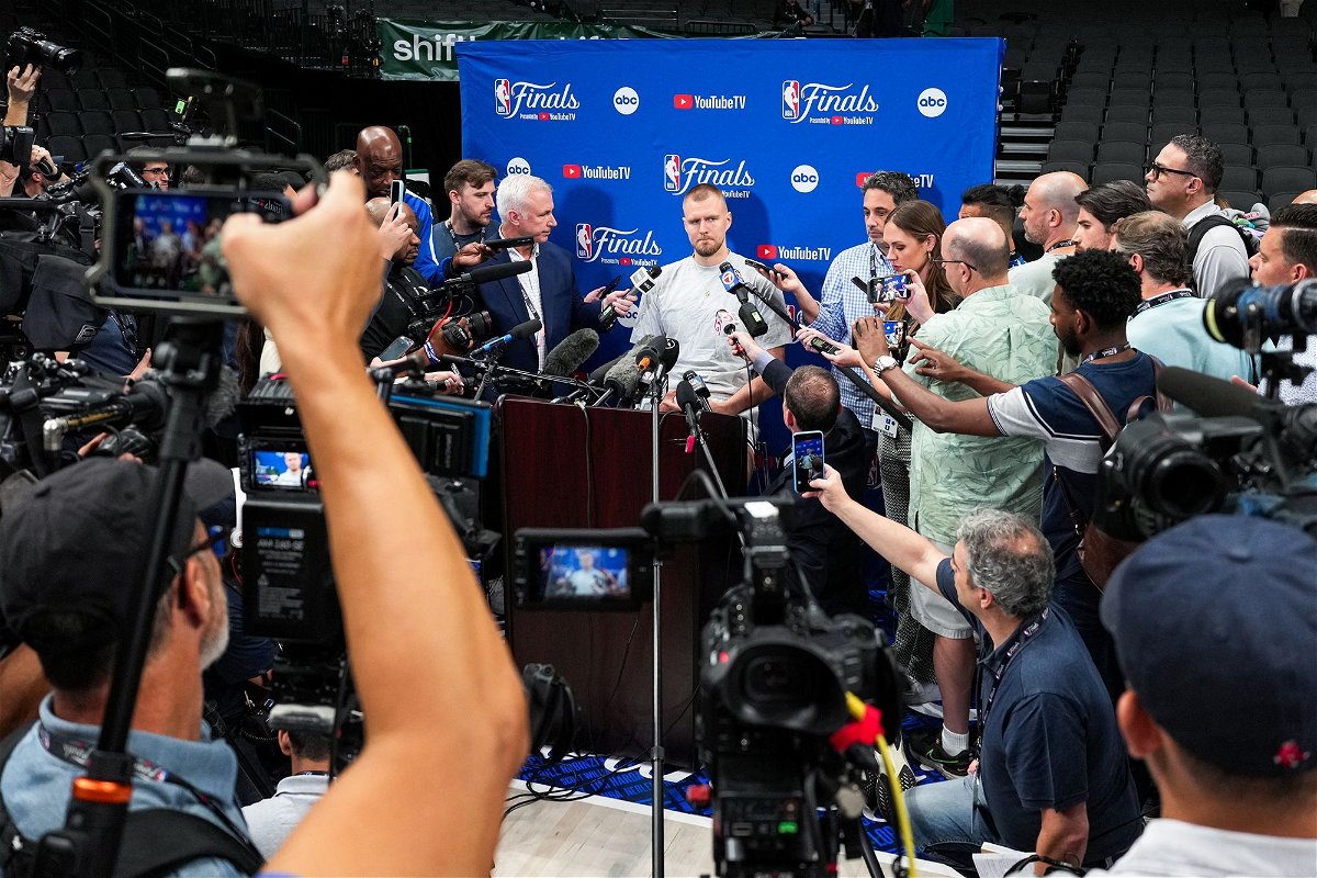 <i>Ryan Stetz/NBAE/Getty Images via CNN Newsource</i><br/>Porziņģis talks to the media ahead of Game 3 of the 2024 NBA Finals.