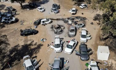 This aerial picture shows abandoned and torched vehicles at the site of the October 7 attack on a music festival in southern Israel on October 13